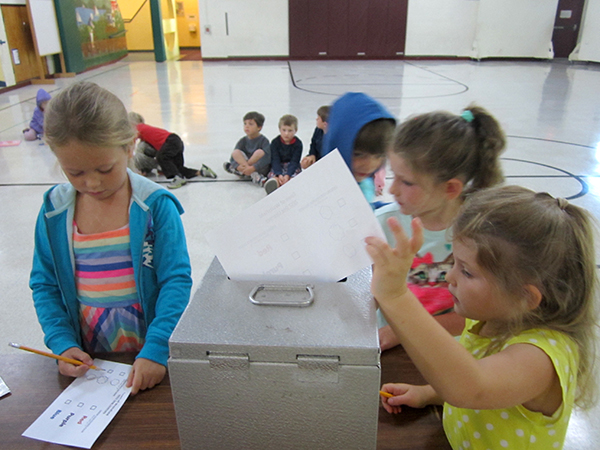 Waitsfield Kindergartners vote on next year's dog licenses. Photo: Jennifer Peterson 